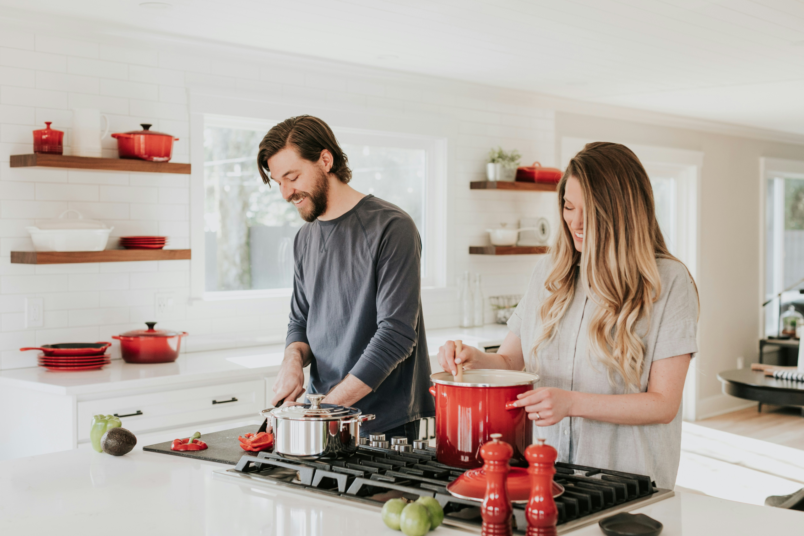 gratitude in relationships - couple cooking together in a kitchen