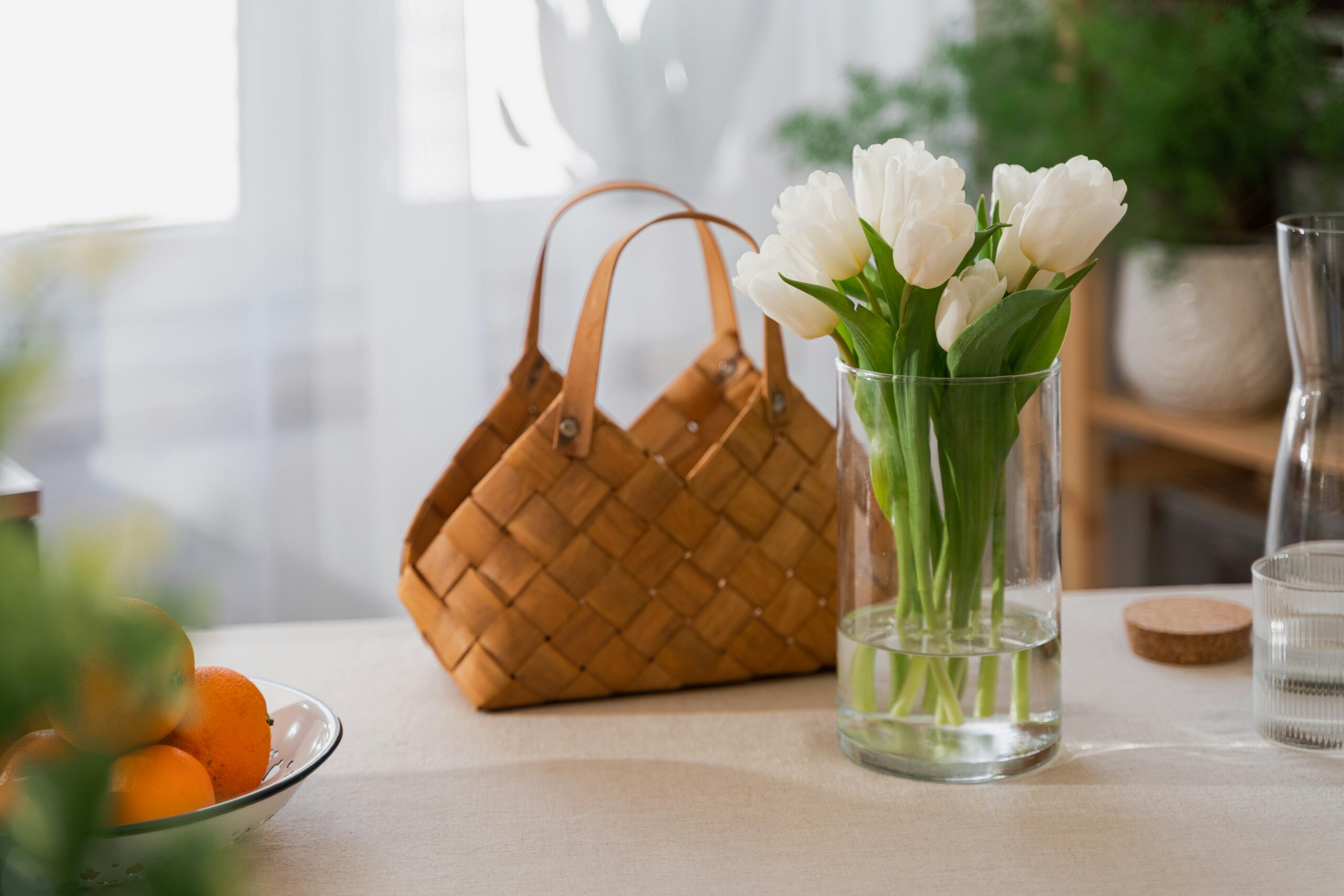 how to create a morning routine that makes you feel good - A bag ready to go in the morning on a counter with beautiful flowers