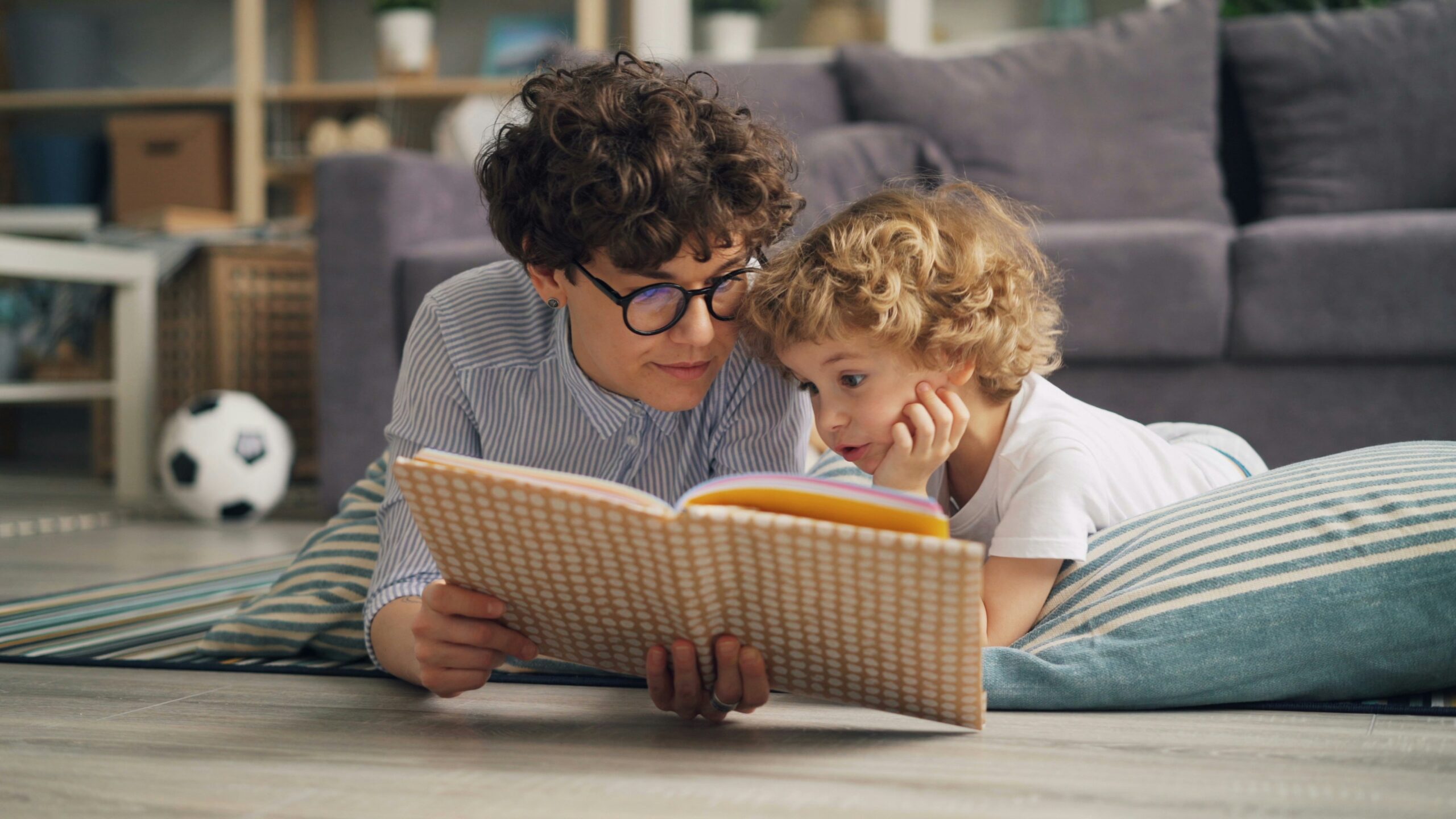 children’s book about being yourself - Mother reading to child on the floor